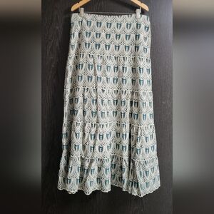 Green and White Eyelet Skirt a tiered maxi-length skirt with a green base
